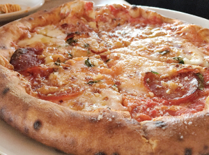 The Calabrian pizza at Apizza Regionalle is topped with tomato sauce, soppressata, house-made mozzarella, caciocavallo cheese, fresh oregano, Calabrian chili and a drizzle of honey. It goes for $15.