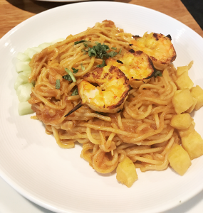 Grilled shrimp with noodles tossed with a spicy peanut sauce and lots of caramelized shallots and garlic.