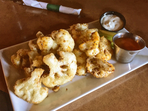 The Evergreen’s angle on wings: appropriately seasoned cauliflower paired with celery, blue cheese and homemade hot sauce.