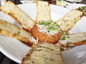 The goat cheese fritter with a light, crunchy shell paired well with the crostini and fra diavolo sauce.