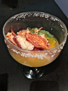 The lobster margarita offers a fine portion of seafood wading in a pool of rosemary and butter sous vide.