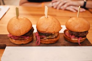 The lamb sliders: Mini lamb burgers topped with pickled red onions, mint and cumin mayo ($13).