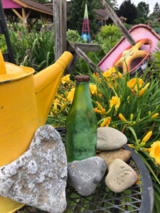 Every now and again I find something especially interesting and wonder how it came to rest there. This unopened green bottle in the photo, for instance. Was it set on a rock during a picnic, the distracted owner moving on to other activities?