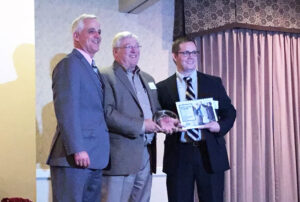 Burdick accepting the award for “Best Places to Work.” Photo provided.