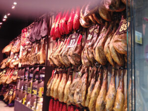 Next to our hotel in Barcelona was a shop selling dry serrano ham, right off the pigs’ legs, hanging row upon row in the window. (2018)