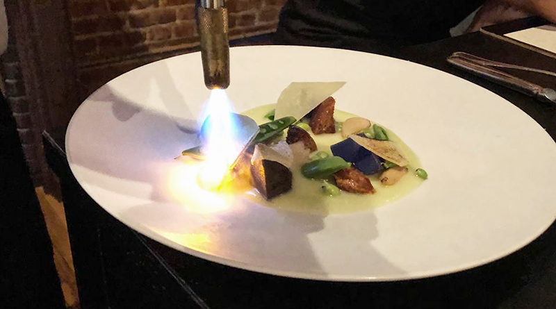Spring Pea Torch: The spring pea and parmesan plate gets special treatment before being served.