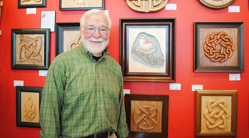 Carl Patrick, Oswego resident former director of nuclear communications for the New York Power Authority. “I wish I had known before I retired how many really interesting things there are to do,” he says. He is shown with his artwork, which is available at Riverside Artisans, an art co-operative in Oswego.