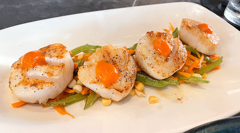Four large diver sea scallops ($35) on a bed of slaw, featuring corn, snow peas and carrots. The quality of the entrée exceeded expectations.