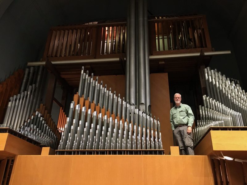 Ben Merchant services the pipe organ at Crouse College, Syracuse University.