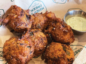 Corn and crab hushpuppies with dressing ($14) are made to be shared